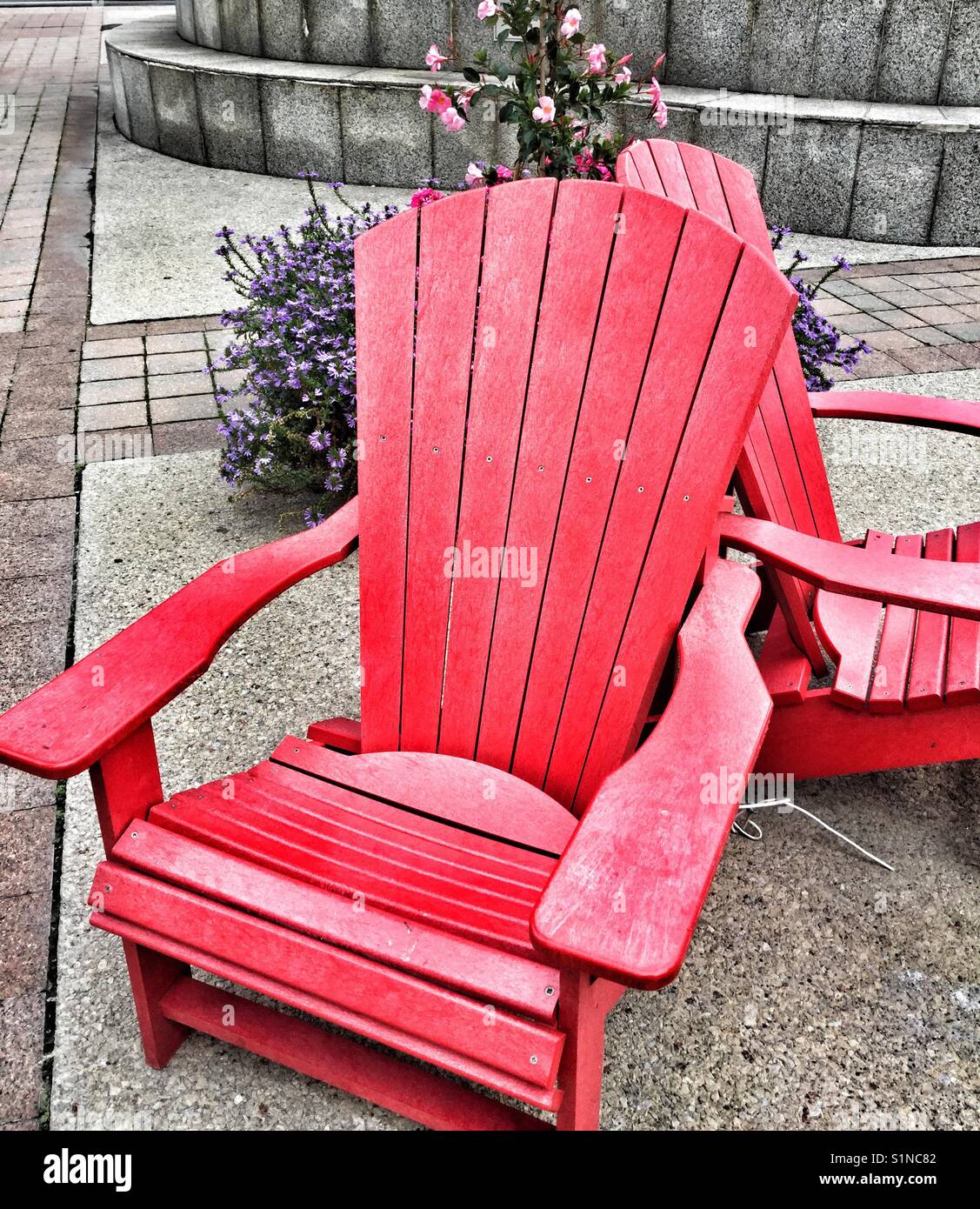 Two red Muskoka chairs in downtown Toronto Stock Photo Alamy