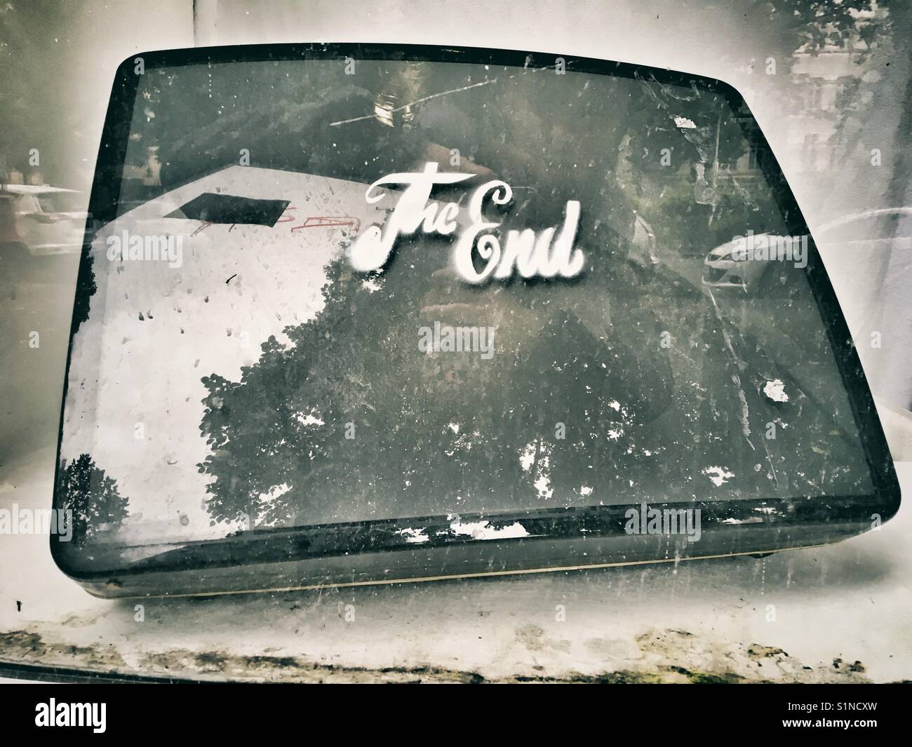 A tv screen with the words the End sprayed on the screen symbolizing the End of the tv era - Smartphone Captured Stock Image