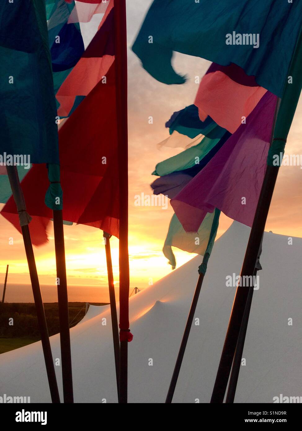 Sunset with flags and marquee Stock Photo