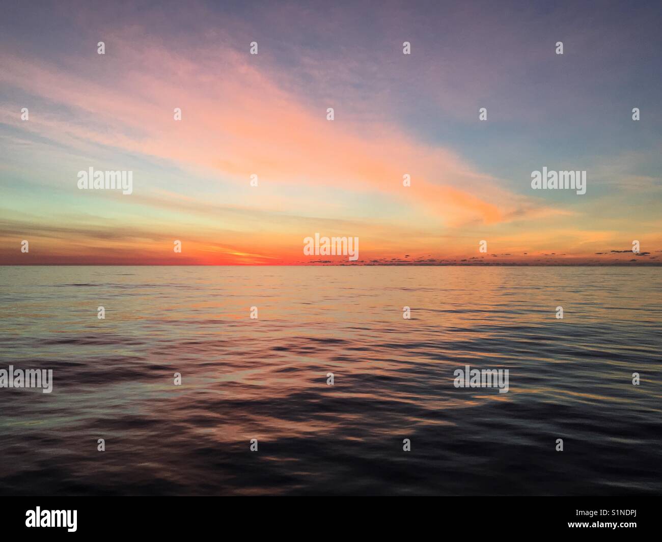 Sunrise on a very calm Atlantic Ocean - Smartphone Captured Stock Image