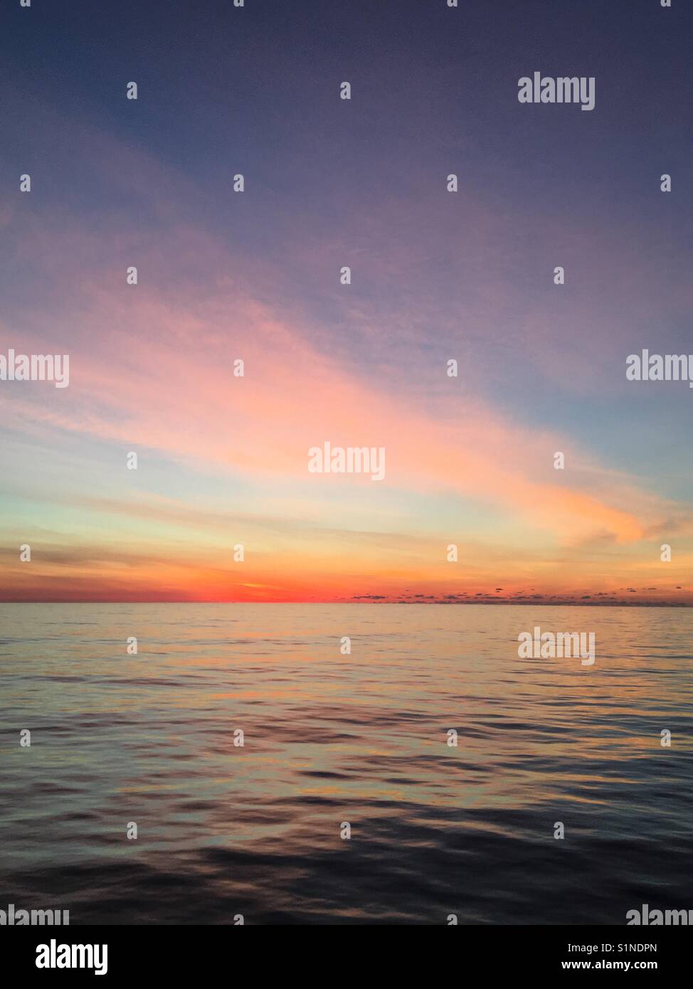 Sunrise on a very calm Atlantic Ocean Stock Photo