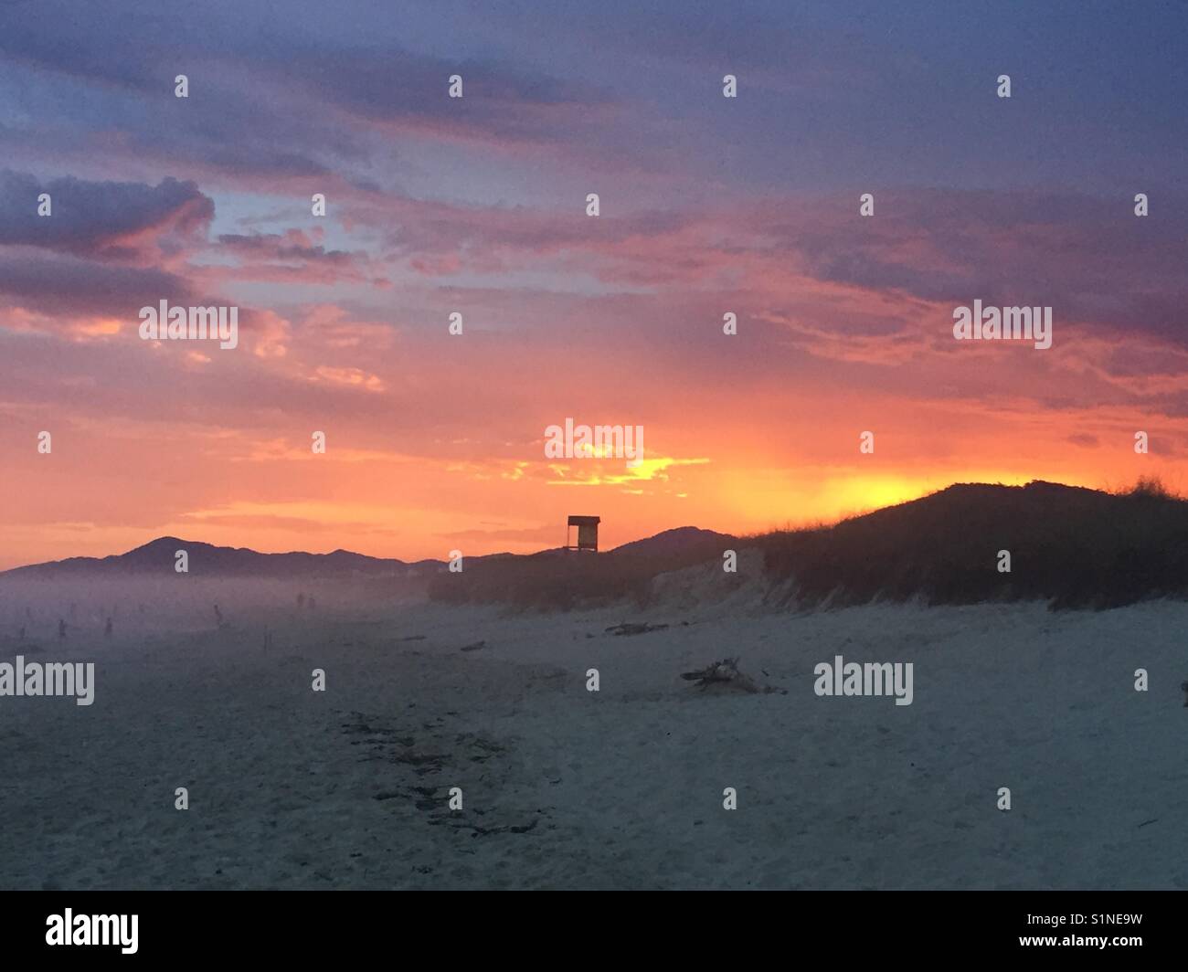 Sunset on the beach Stock Photo - Alamy