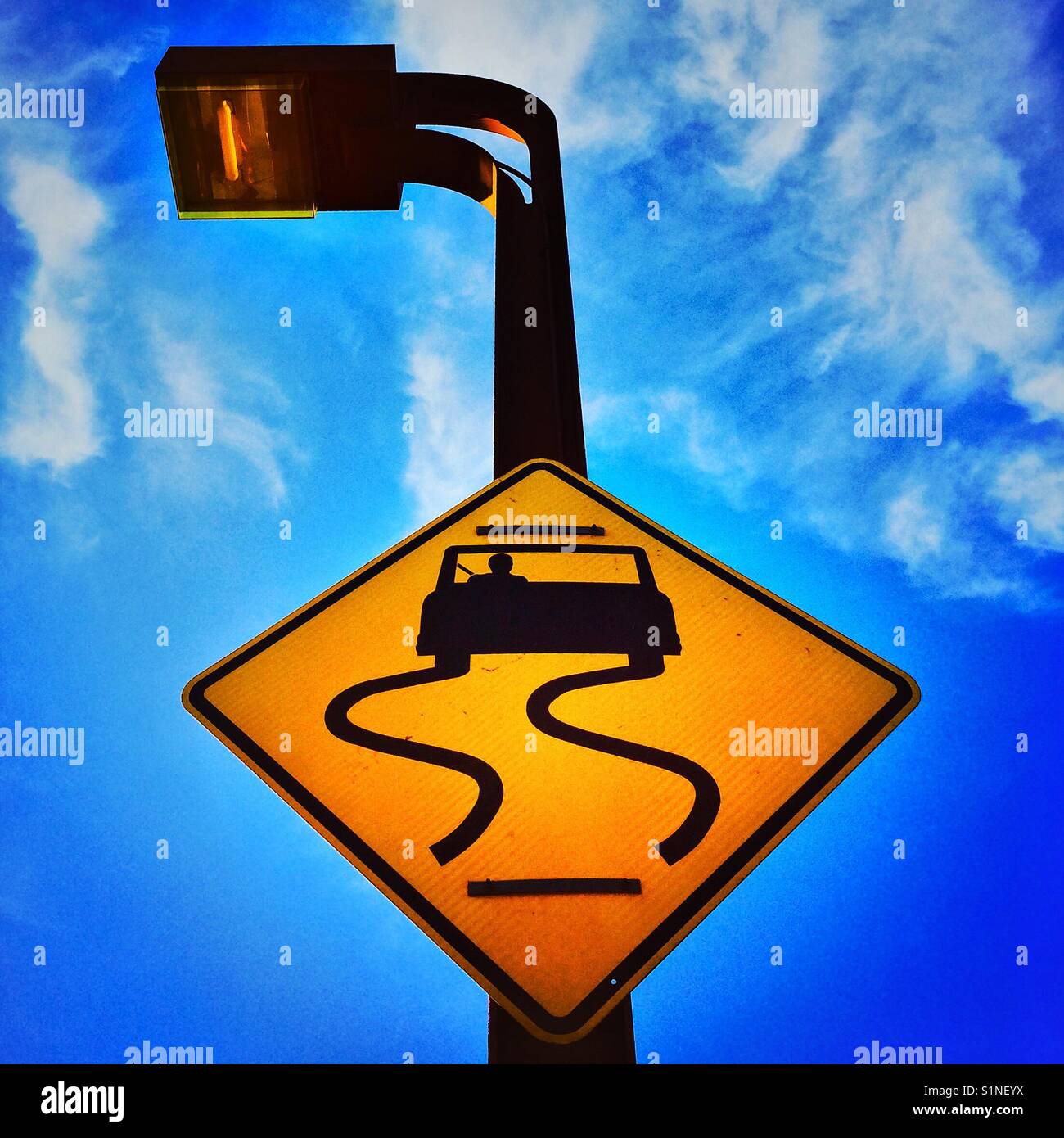 Curves road sign at SF Golden Gate Bridge, San Francisco, California, USA - Smartphone Captured Stock Image