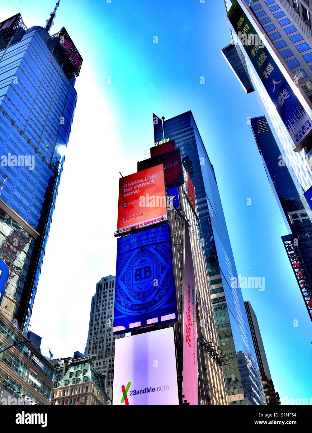 Skyscrapers in time square covered with billboards in advertising, New York City, USA - Smartphone Captured Stock Image