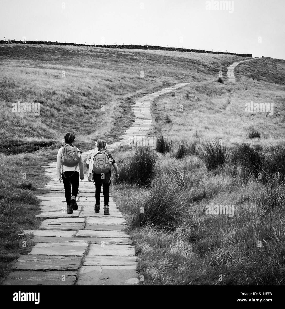 Two girls walking in the Yorkshire Dales, England. Stock Photo