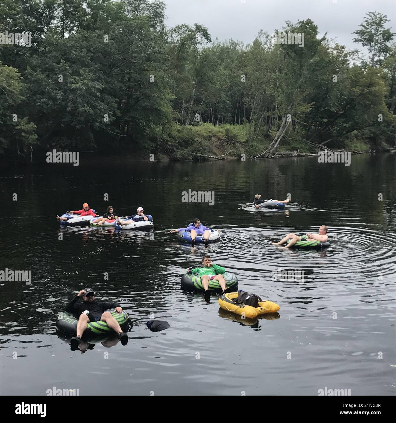 Tubing down a river Stock Photo Alamy