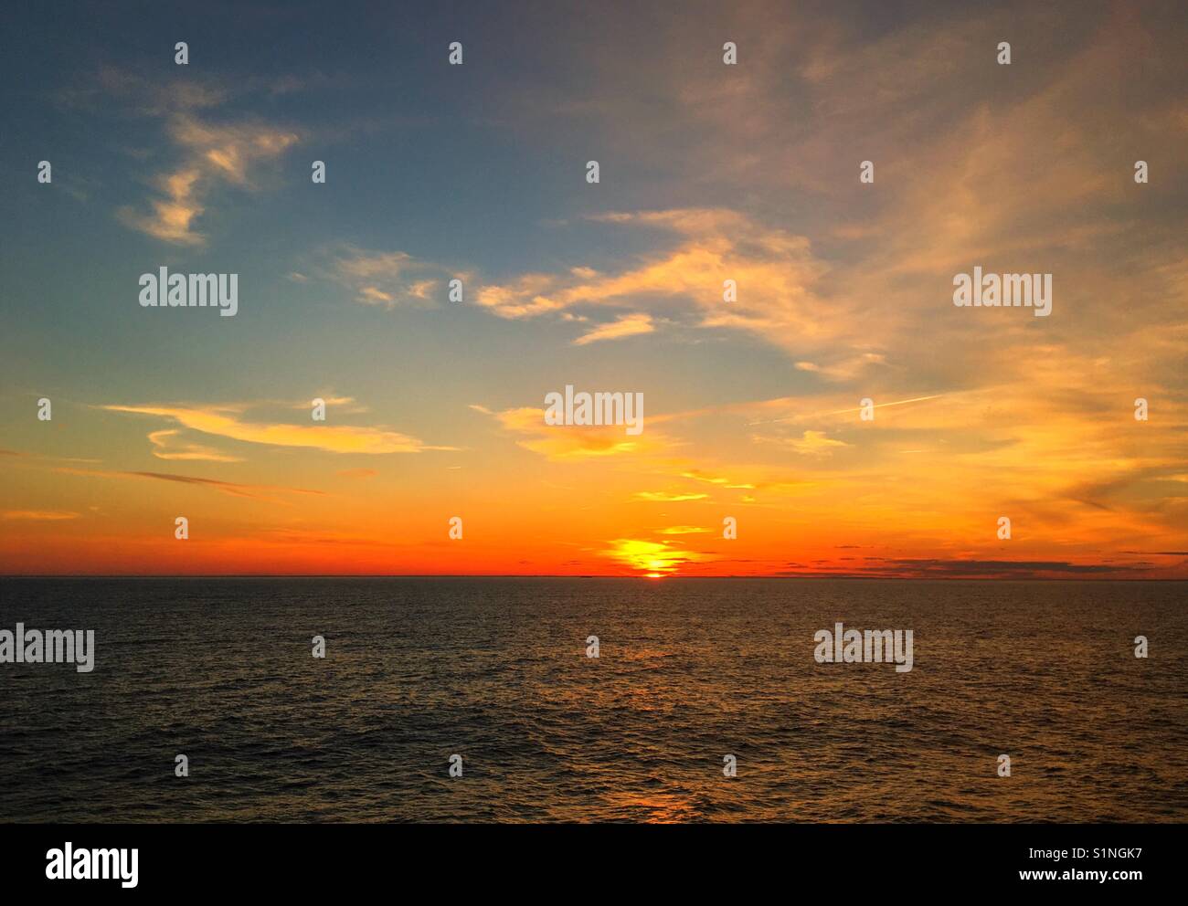 Colourful sky as the sun rises over the Atlantic Ocean - Smartphone Captured Stock Image