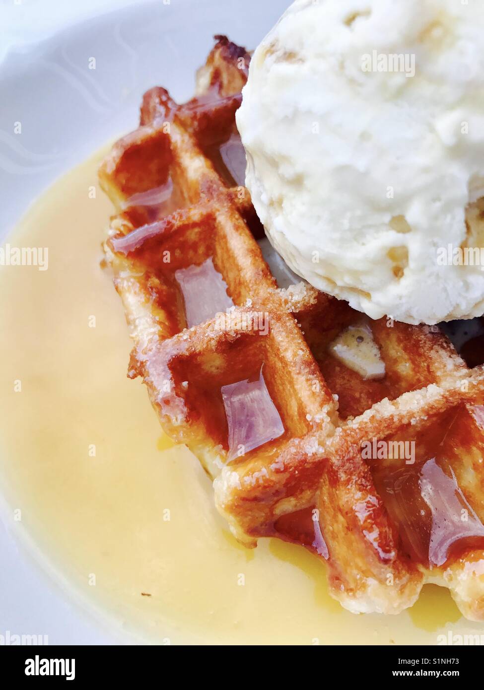 Sticky toffee Belgian waffle with ice cream Stock Photo Alamy