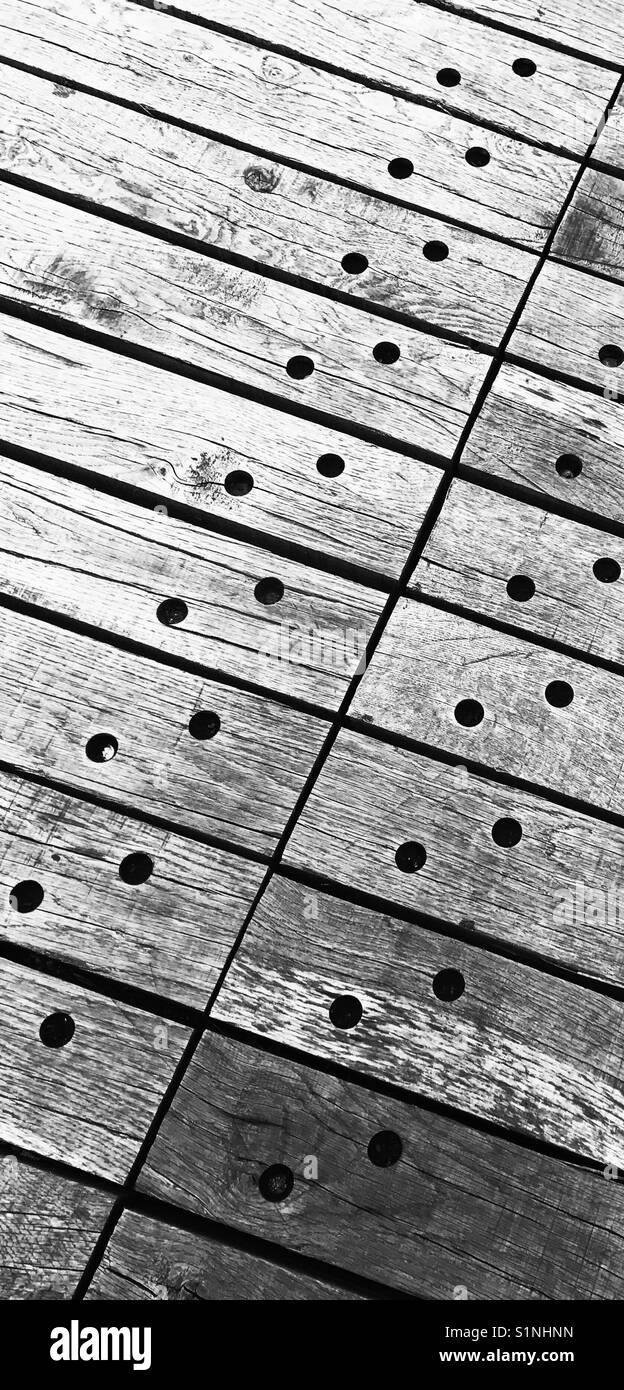 Hi contrast black and white image of pattern formed by wooden planks used for flooring Stock Photo
