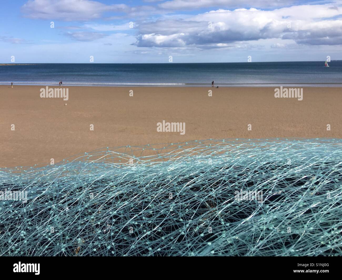 Fishing nets drying in the sun beside the sea - Smartphone Captured Stock Image