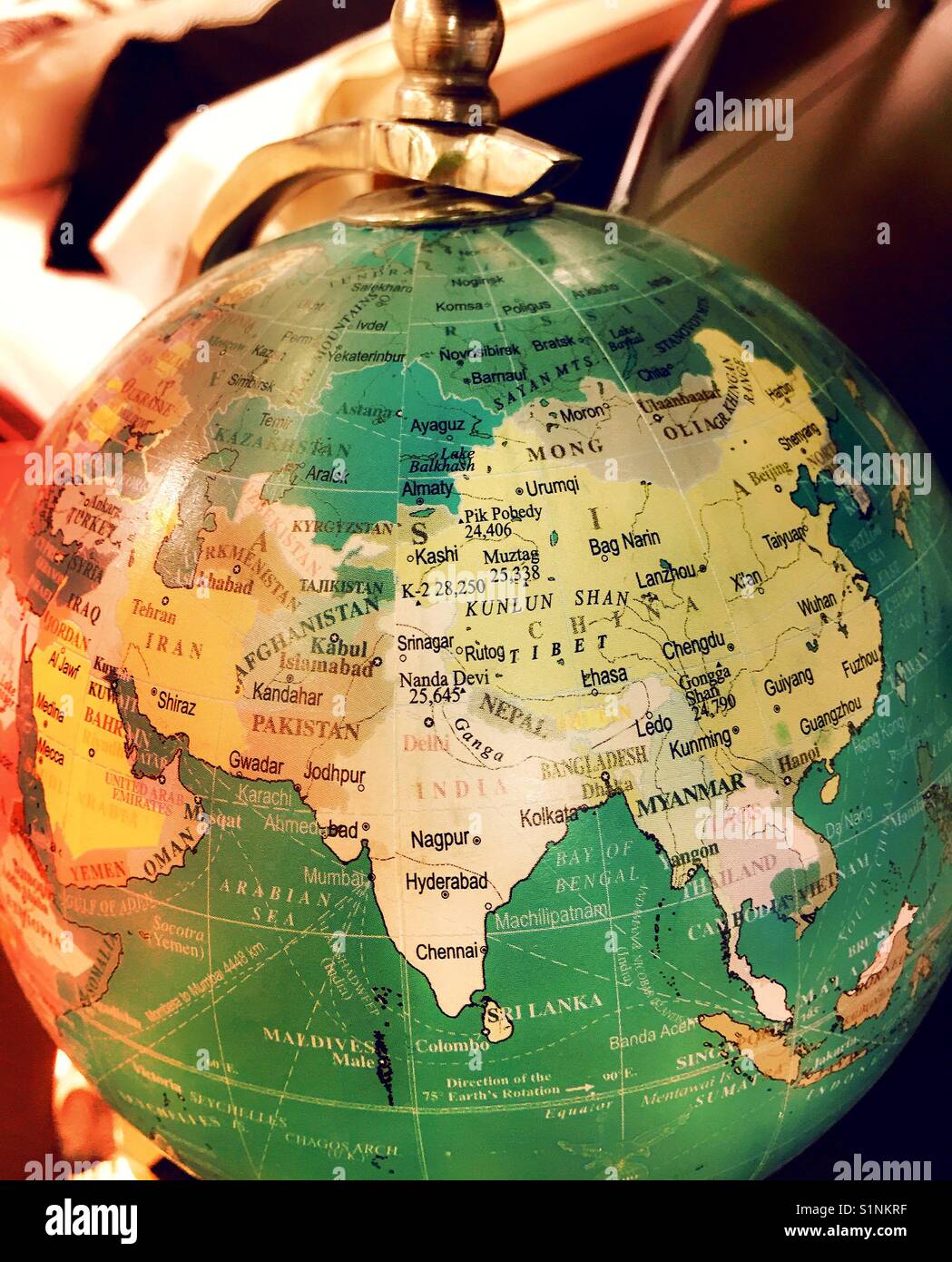 Globe Christmas ornament on display in Macy’s holiday Lane, NYC, USA - Smartphone Captured Stock Image