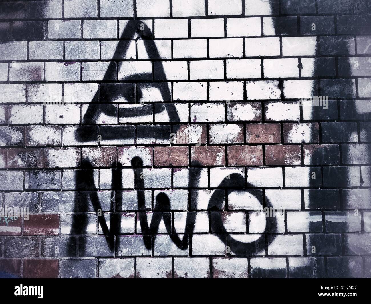 NWO New World Order graffiti on a wall in Berlin, Germany Stock