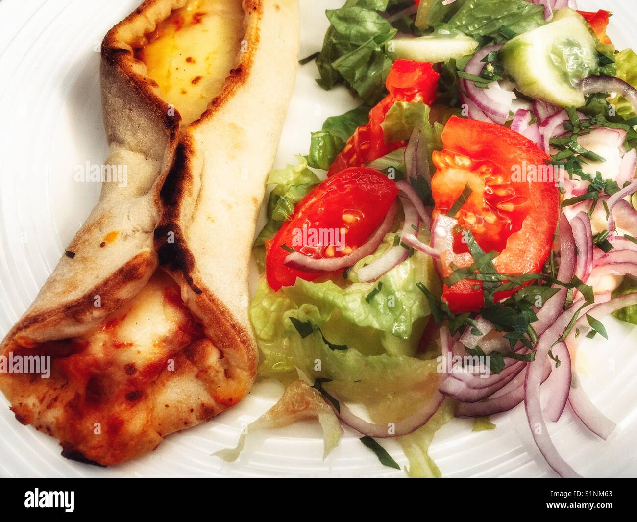 Crosta & Mollica street pizza with salad - Smartphone Captured Stock Image