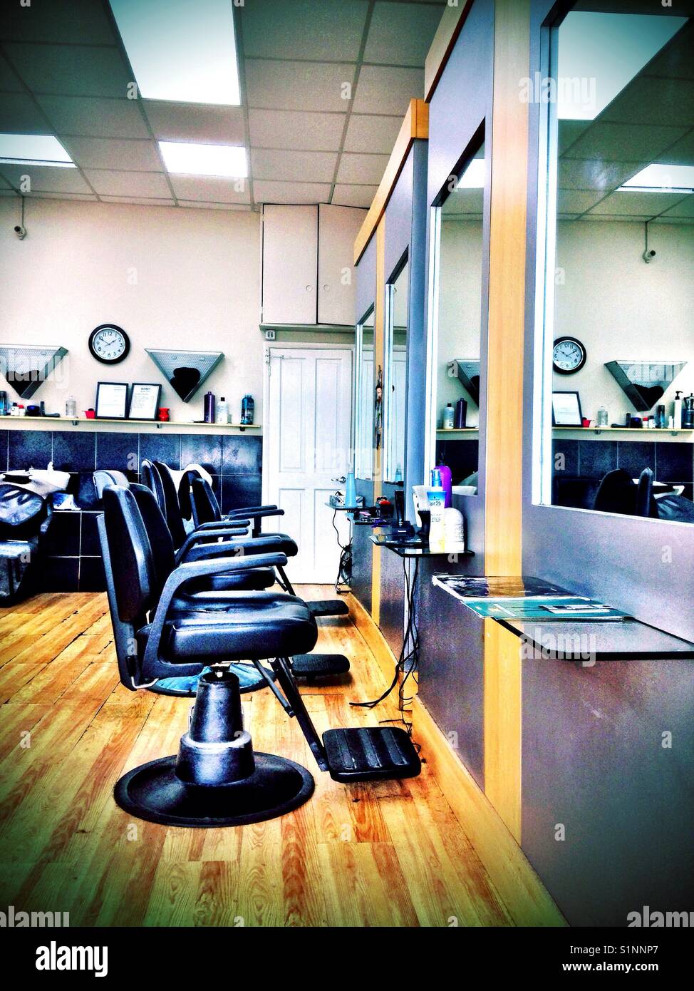 Empty chairs in a barbers shop. - Smartphone Captured Stock Image