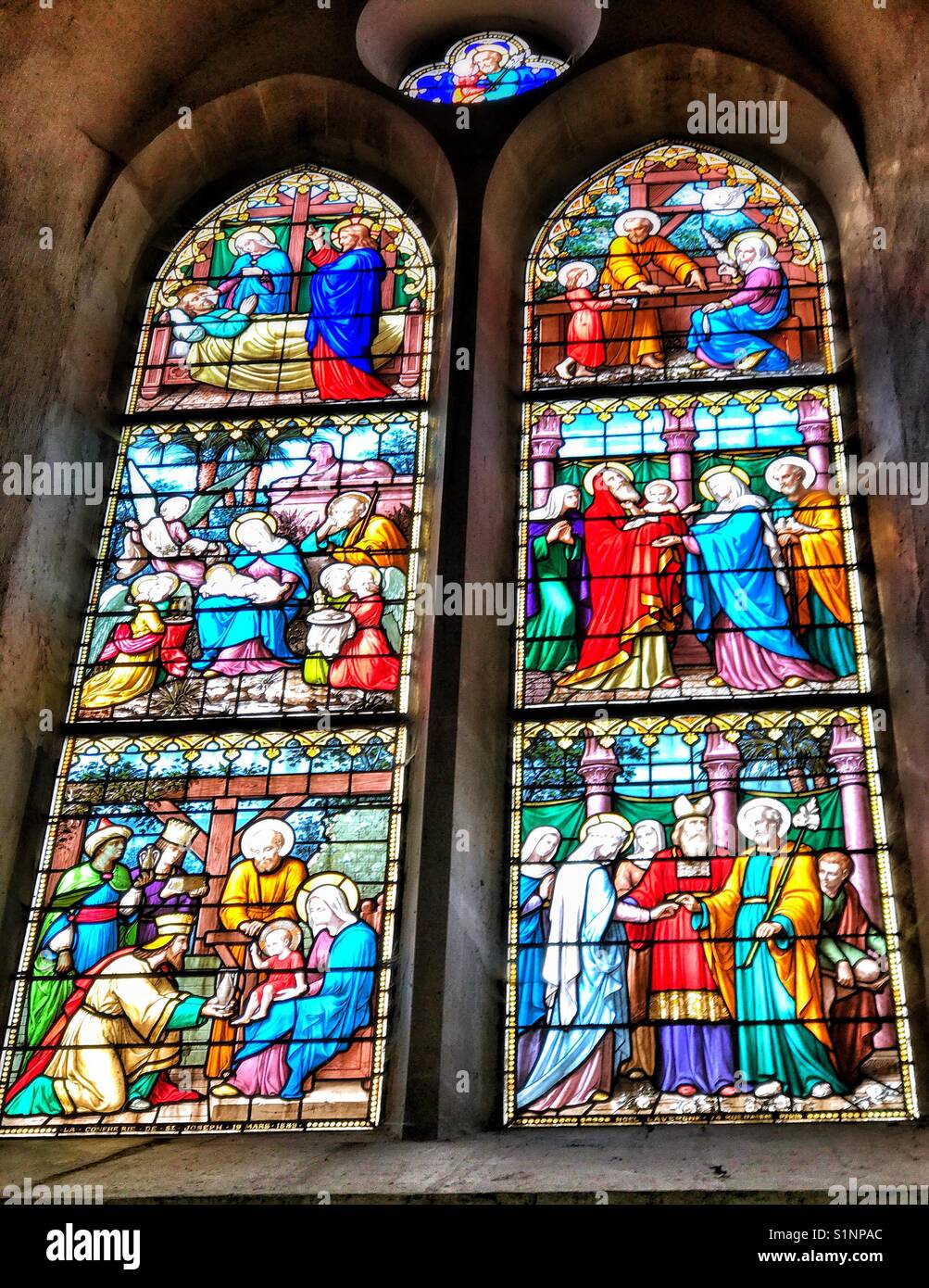 Stain glass in a medieval church. Stock Photo