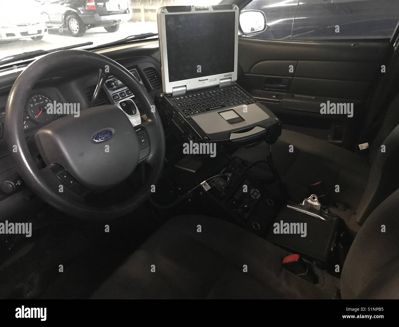 Mobile computer in an American police car. Ford Interceptor. - Smartphone Captured Stock Image