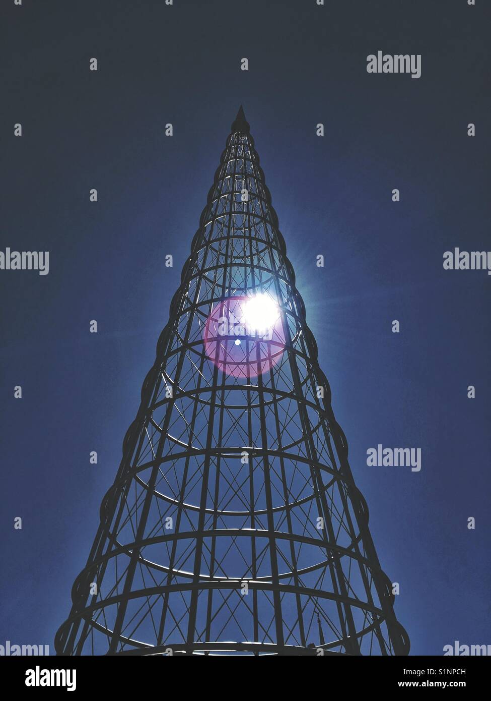 Sunlight through a metal cone of a veteran monument in Stillwater, Minnesota , USA - Smartphone Captured Stock Image