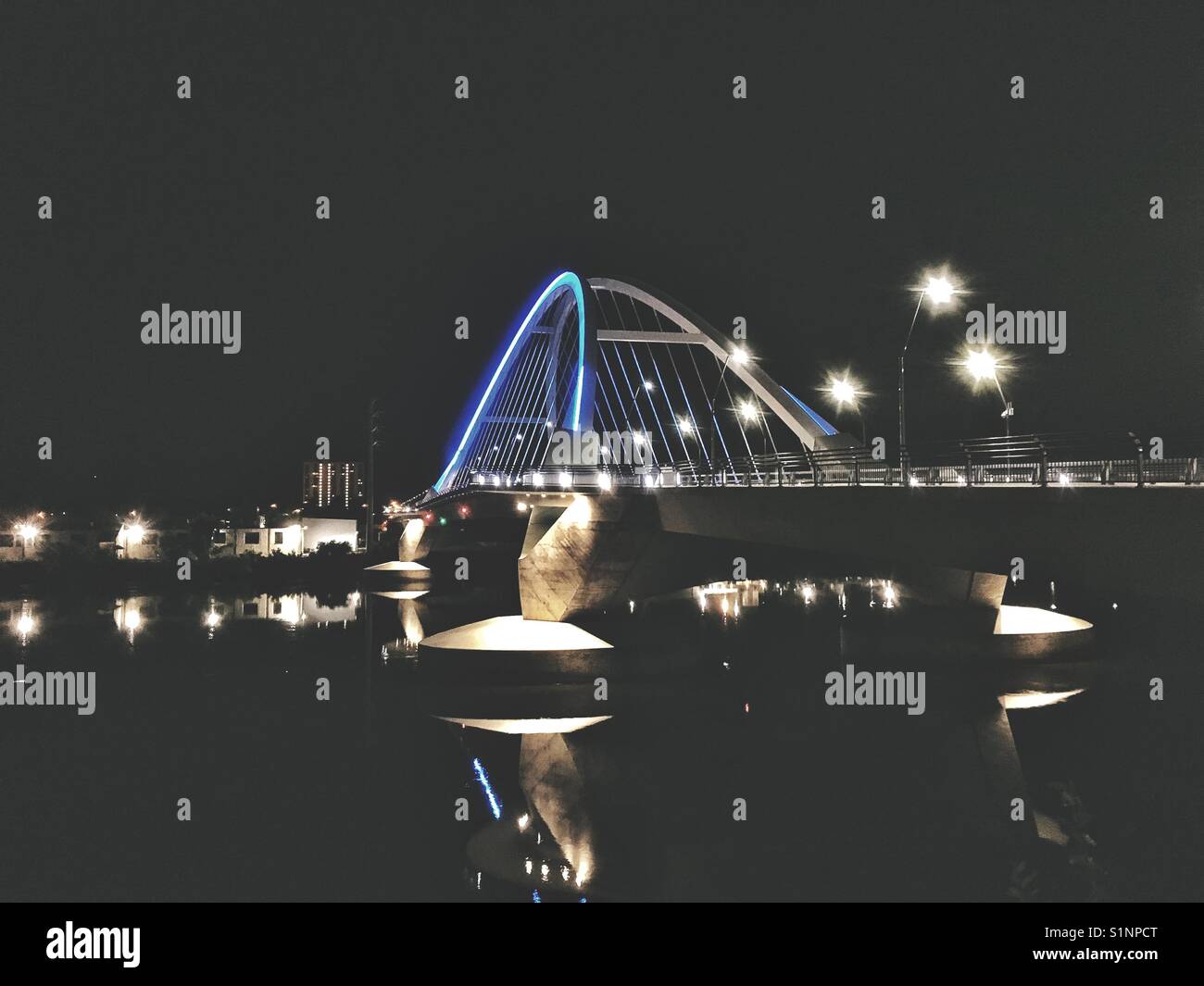 Lit up bridge at night - Smartphone Captured Stock Image