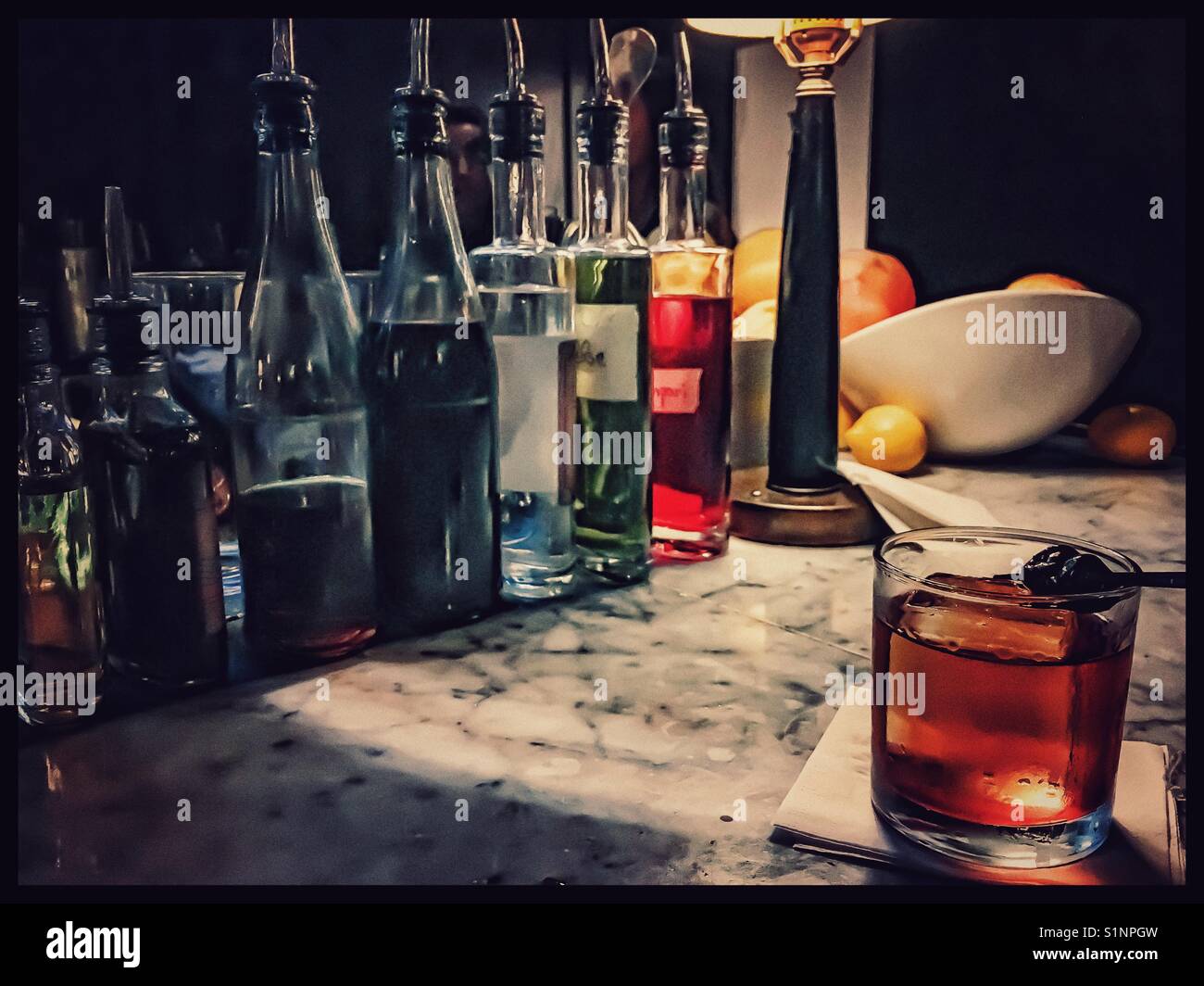 Manhattan whiskey drink on bar counter Stock Photo Alamy