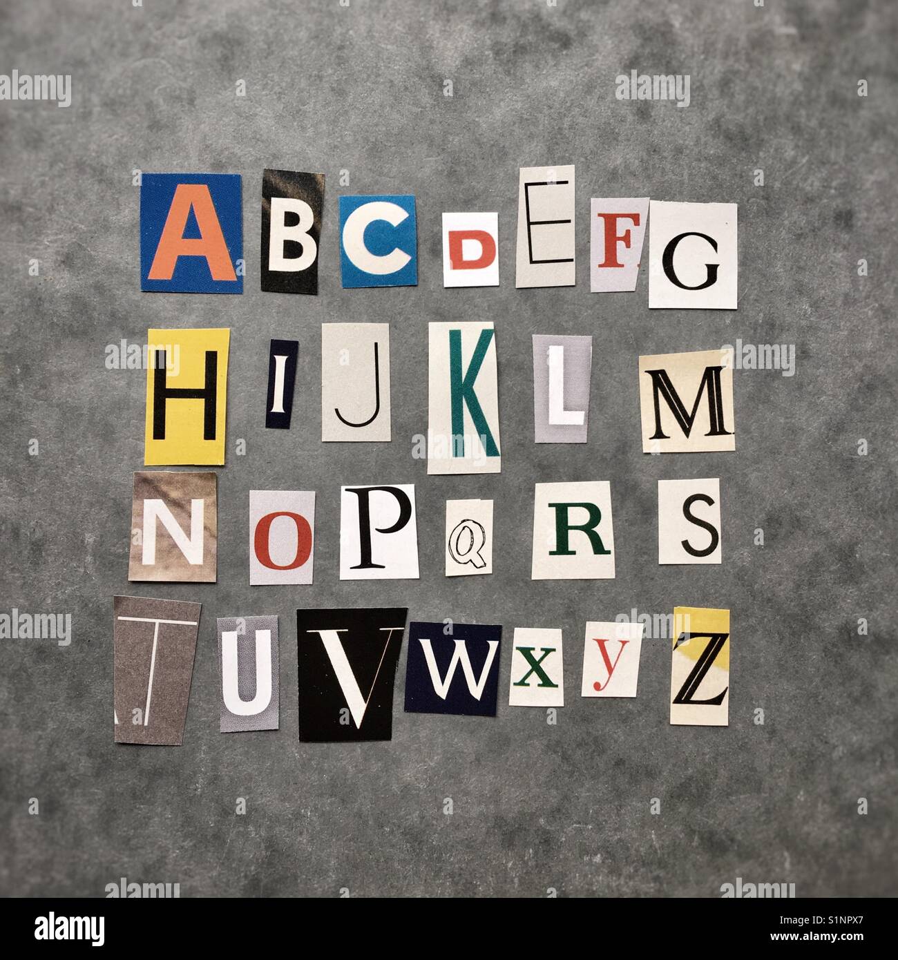 Alphabet laid out with newspaper cutouts Stock Photo
