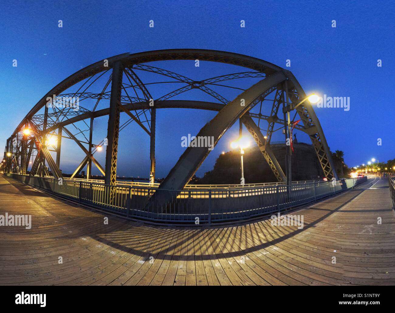Alexandra Bridge over Ottawa River connects the city of Ottawa, Ontario with the city of Gatineau, Quebec, both in Canada, September 2017. Photomerge technique mimics fish eye. - Smartphone Captured Stock Image