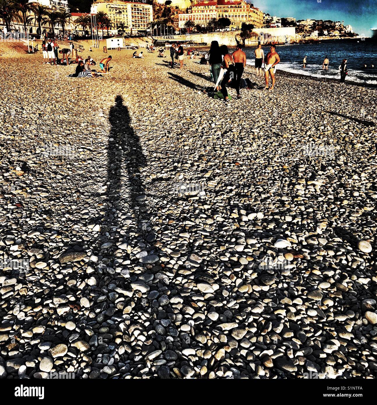 Long shadow on beach in Nice, France. Stock Photo