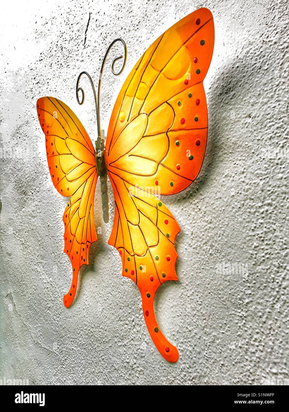 Metal butterfly wall decoration - Smartphone Captured Stock Image