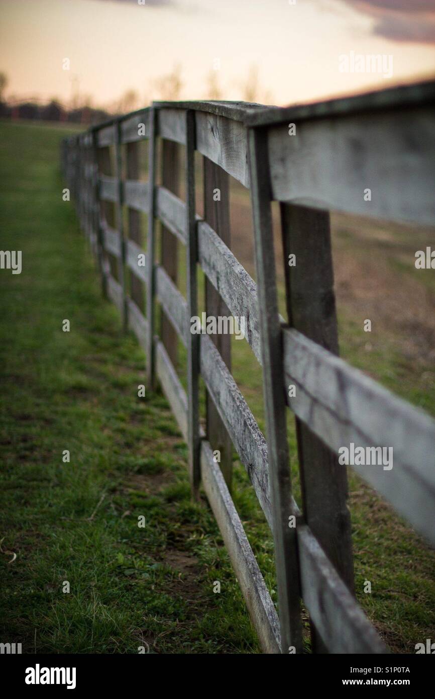 Fence at sunset Stock Photo - Alamy