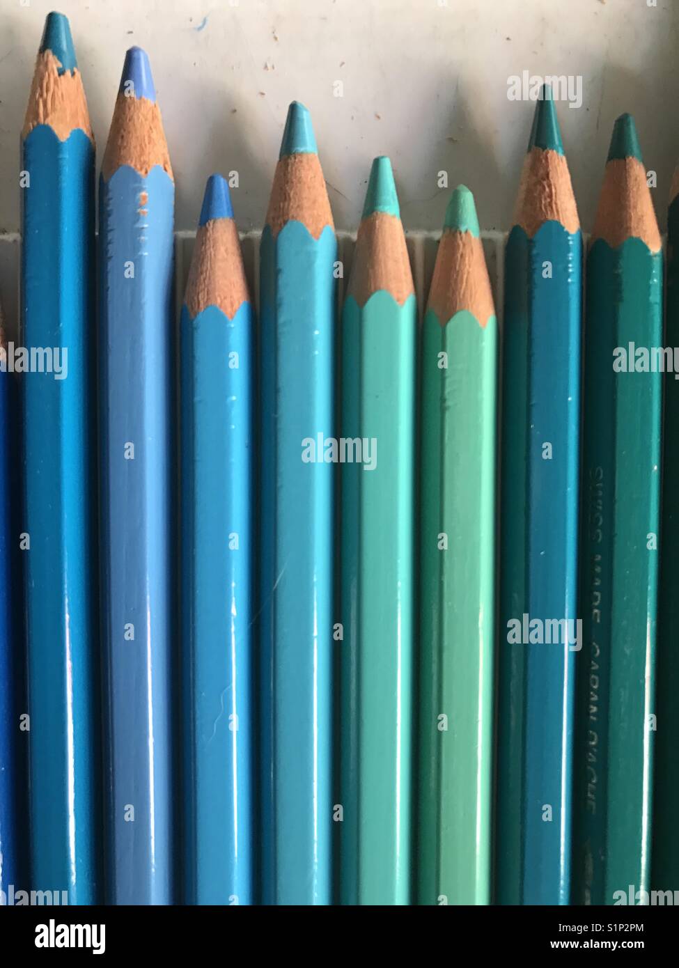 Colored pencils in shades of blue Stock Photo - Alamy