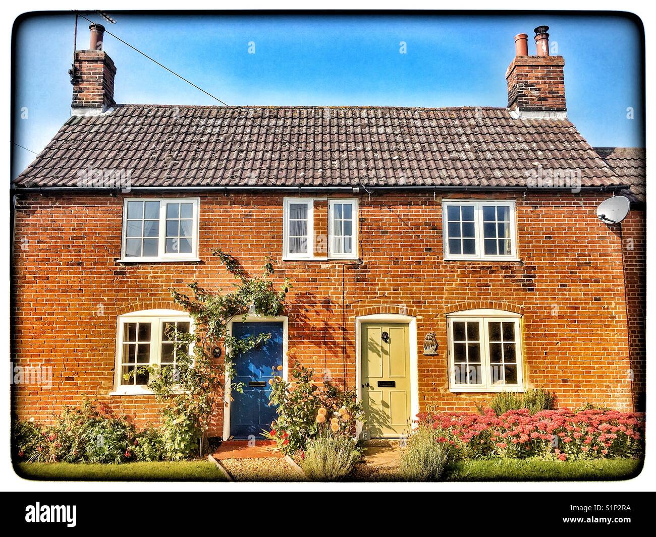 Semi detached cottage, Bawdsey, Suffolk, England. - Smartphone Captured Stock Image