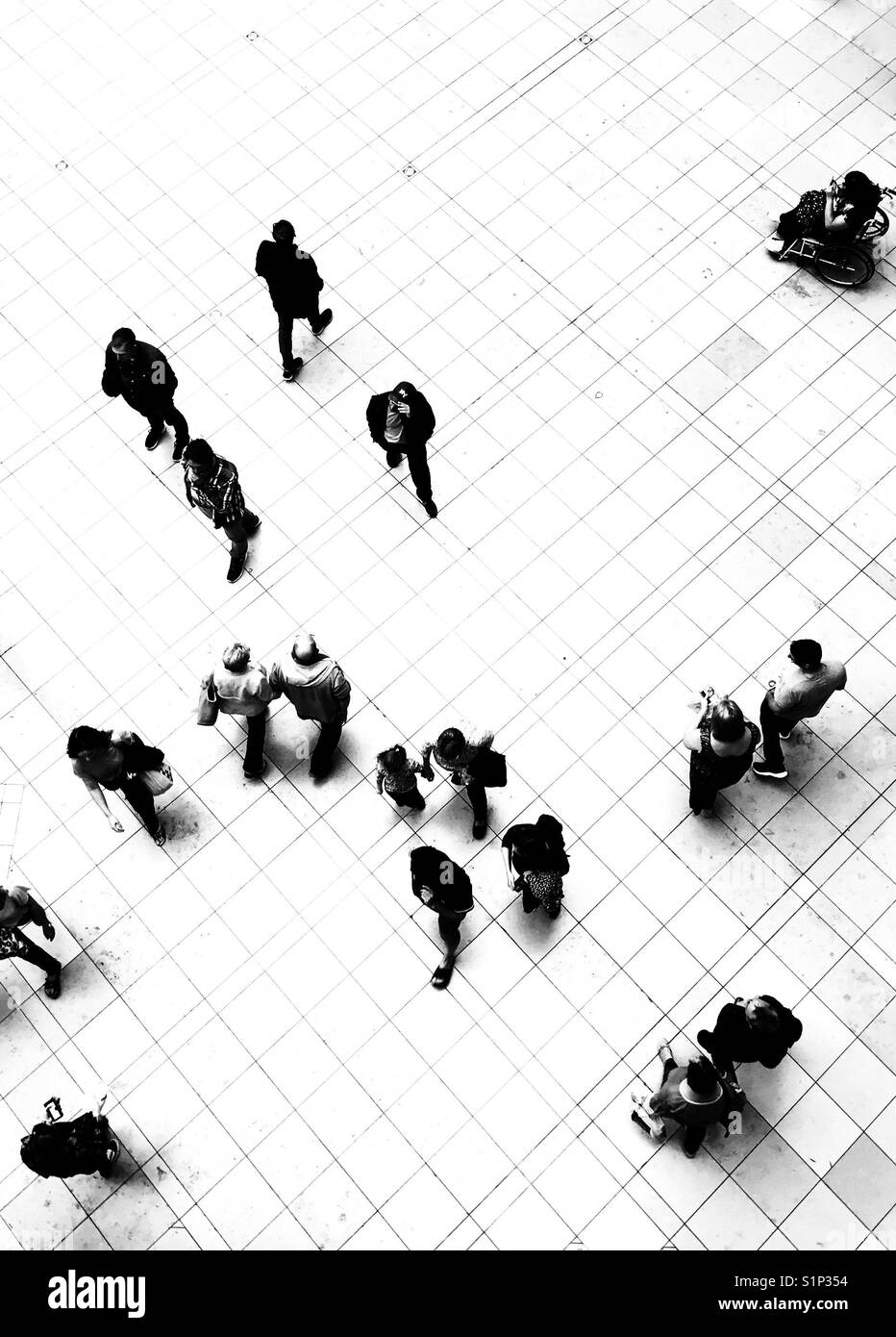 Silhouette of people walking on the ground floor of the Grand Arcade shopping centre in Cambridge, UK - Smartphone Captured Stock Image