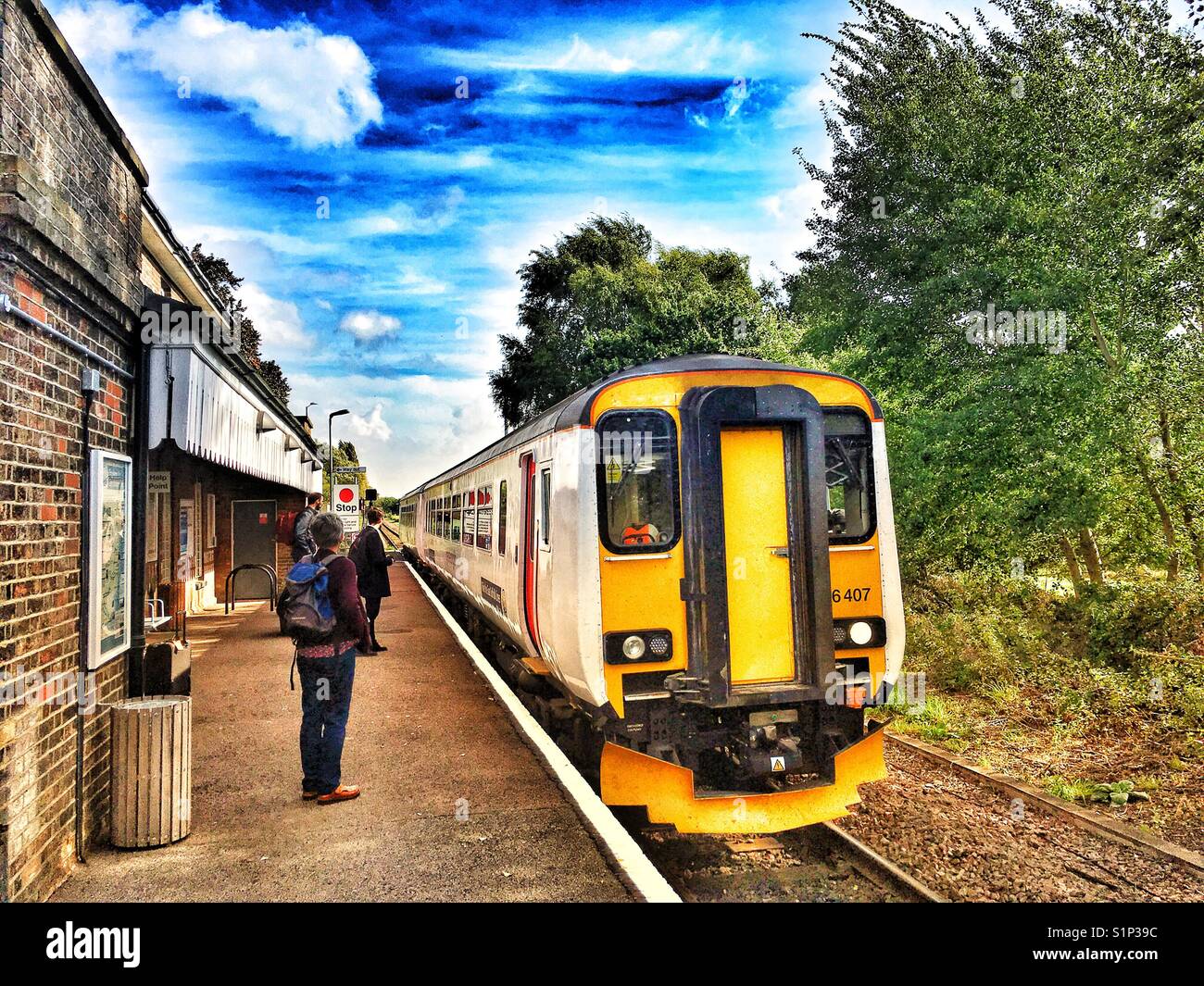 Passenger train arriving at Melton on the 49-mile East Suffolk branch line from Lowestoft to Ipswich, Suffolk, England. - Smartphone Captured Stock Image