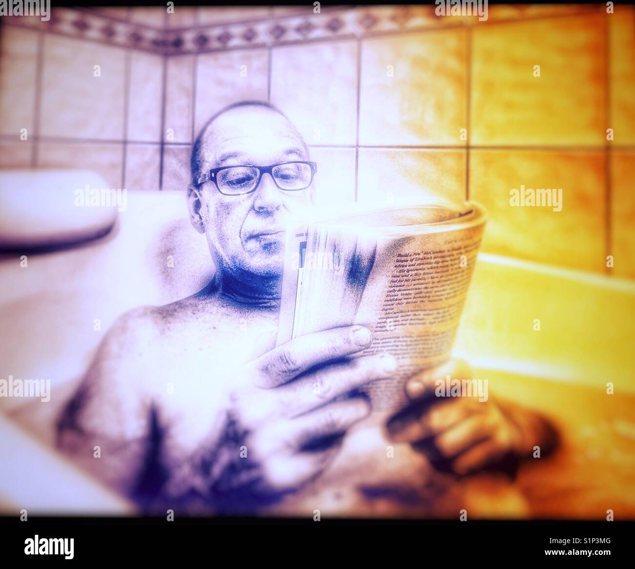 Middle aged man relaxing reading a book in the bath - Smartphone Captured Stock Image