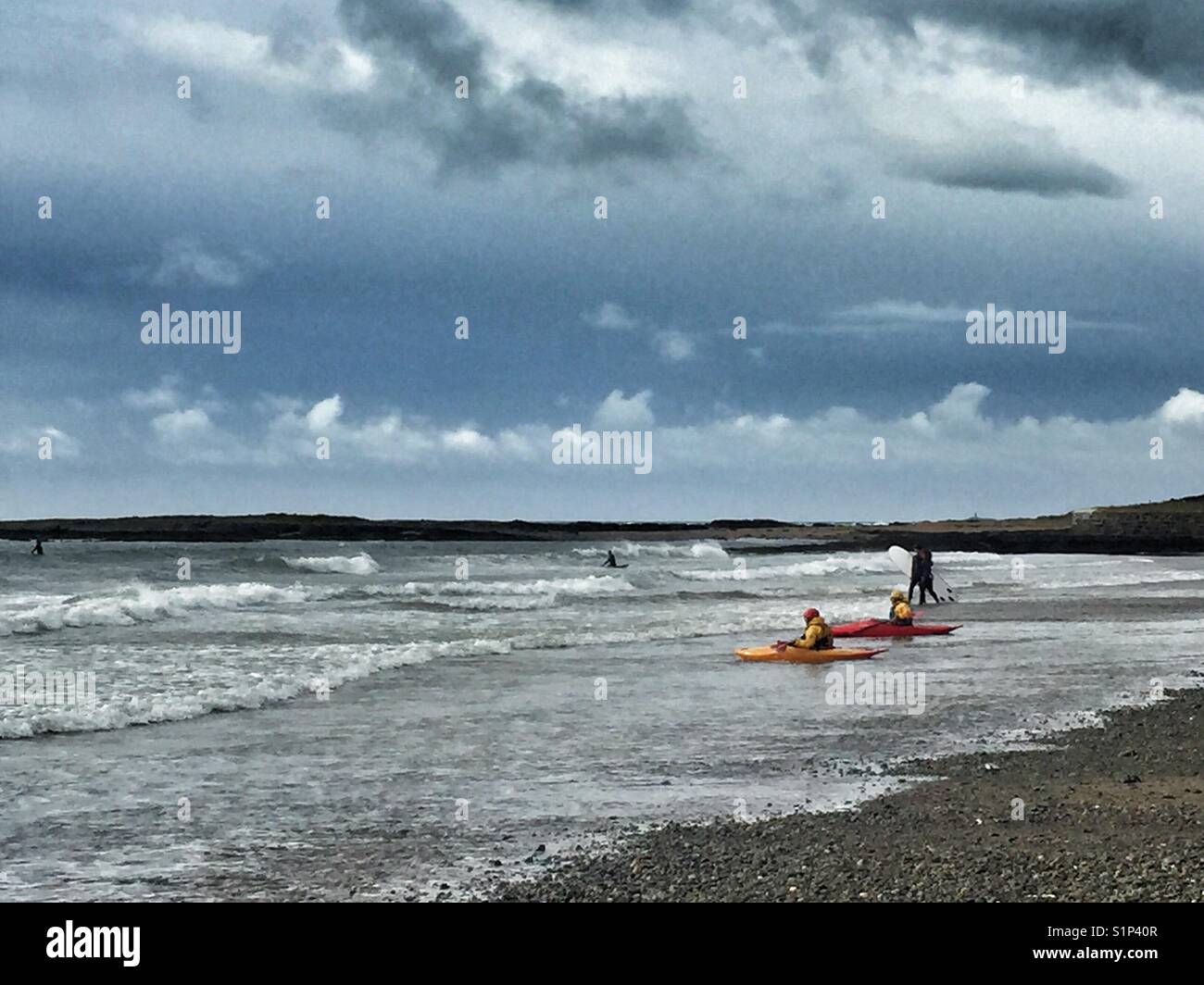 Surf kayaks on Broad Beach, Rhosneigr, North Wales, Anglesey - Smartphone Captured Stock Image