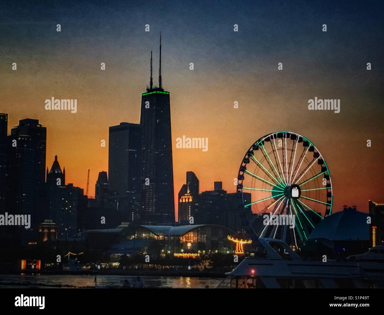 Night lights at Navy Pier, Chicago during sunset Stock Photo
