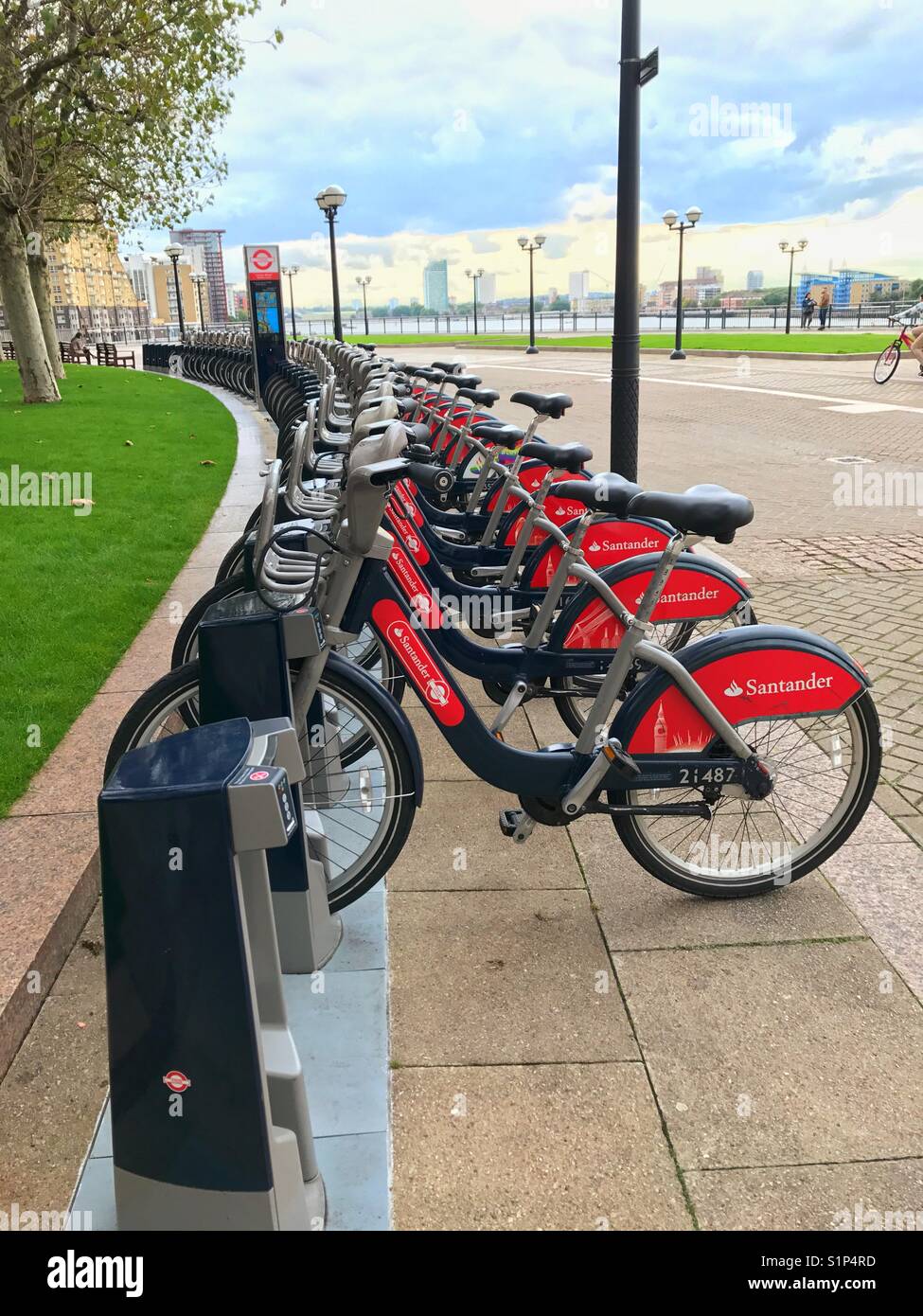 Row of London hire bikes at Westferry Circus by the River Thames - Smartphone Captured Stock Image