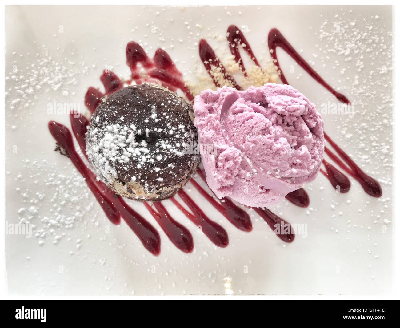 Chocolate fondant with blueberry ice cream . - Smartphone Captured Stock Image