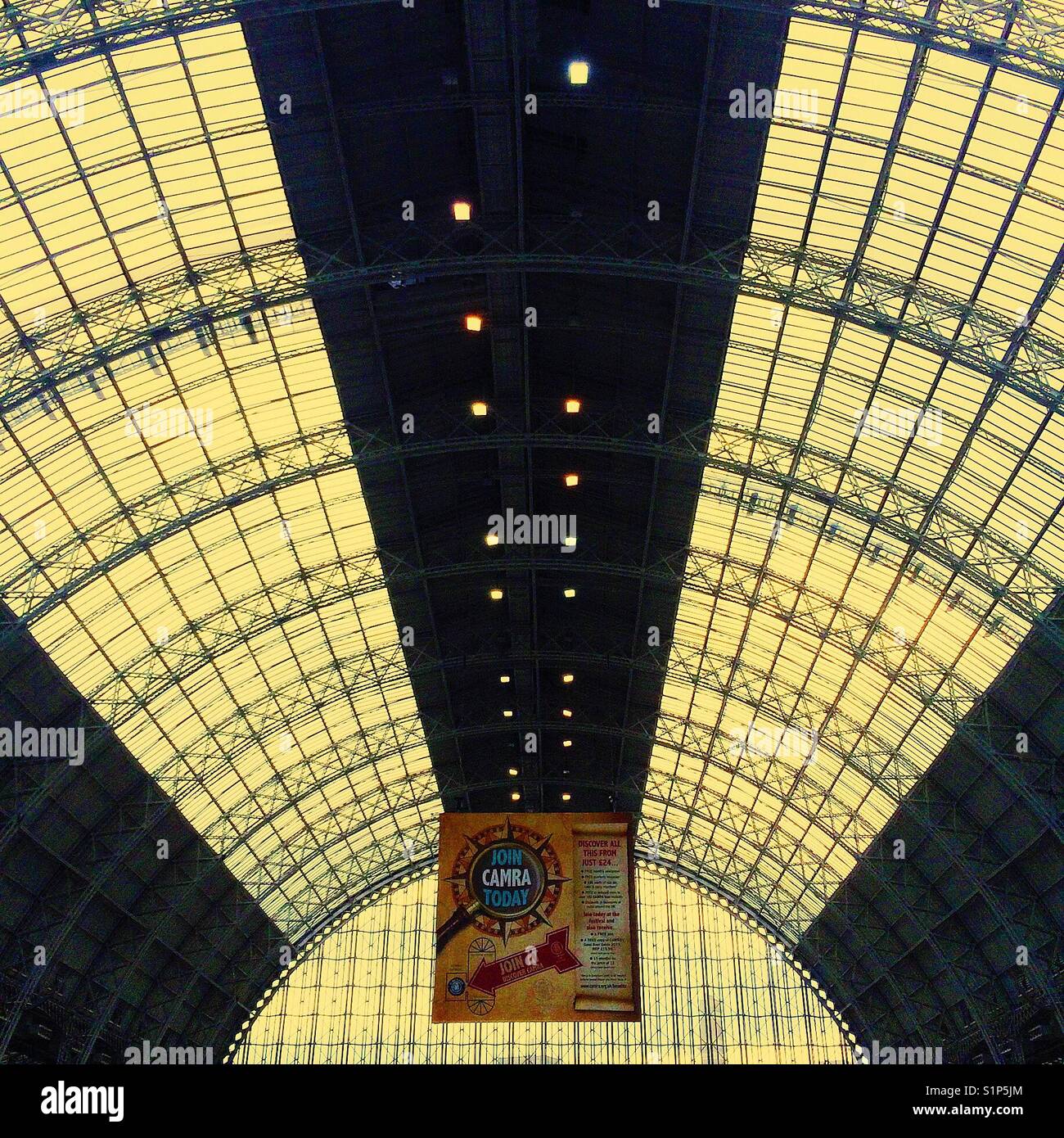 Looking up at the ceiling inside London Olympia at CAMRAs Great British Beer Festival. - Smartphone Captured Stock Image