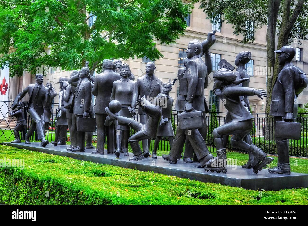 Community (2001) 21 bronze life size sculpture figures by Kirk Newman, Bloor St East, Toronto, Canada - Smartphone Captured Stock Image