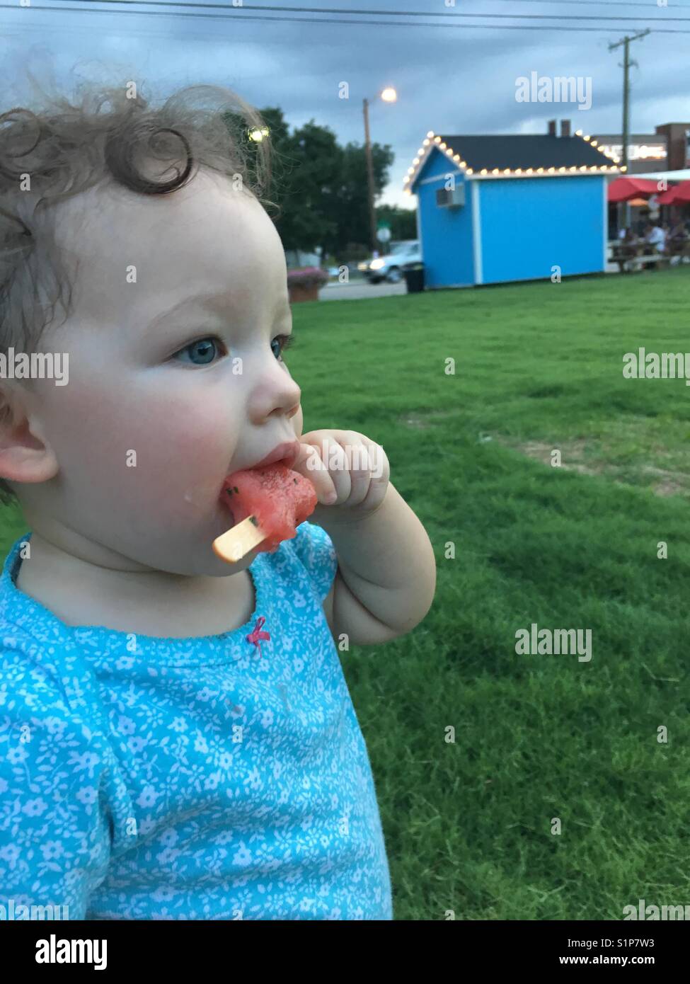 Girl eats popsicle Stock Photo