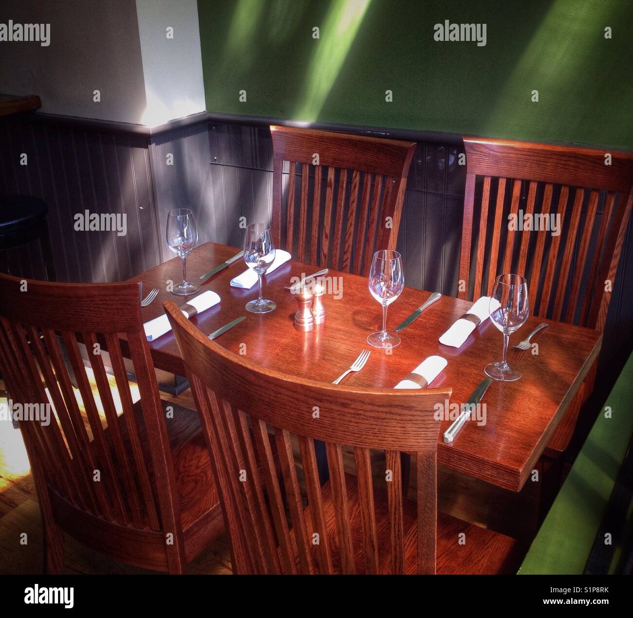 Dining table at the Wood Tavern in Oakland, California. - Smartphone Captured Stock Image