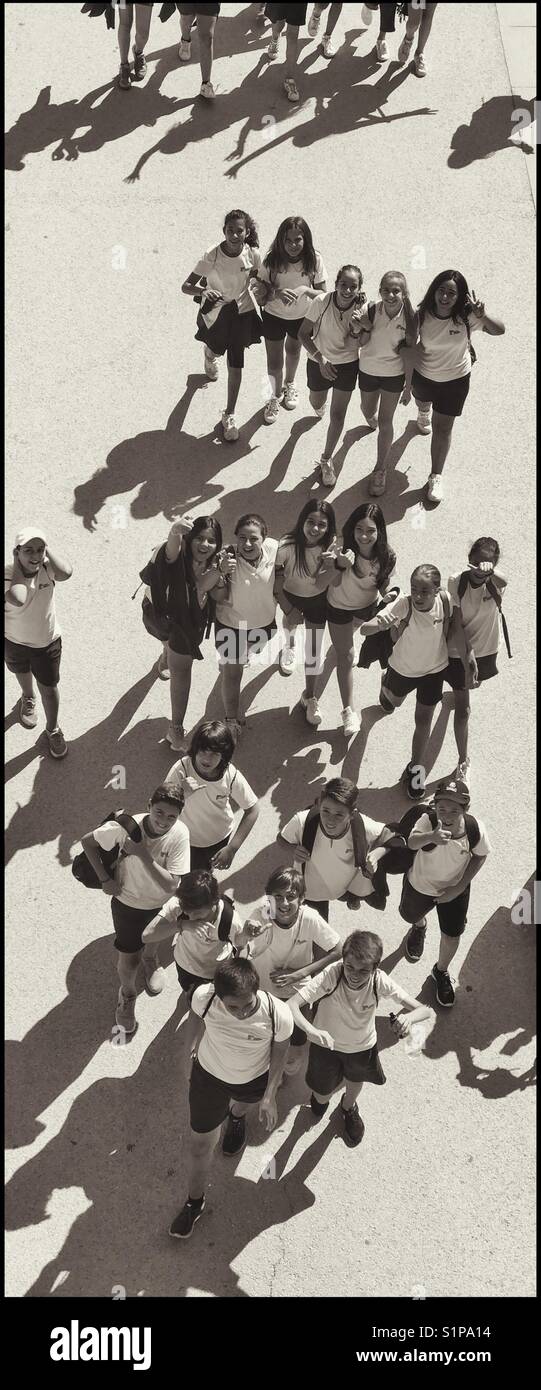 An aerial view of European school children. It's summer, the sun is ...