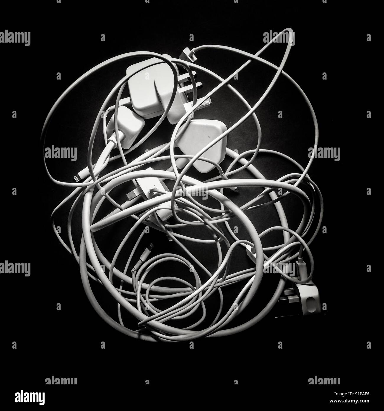 A tangle of charging wires - Smartphone Captured Stock Image