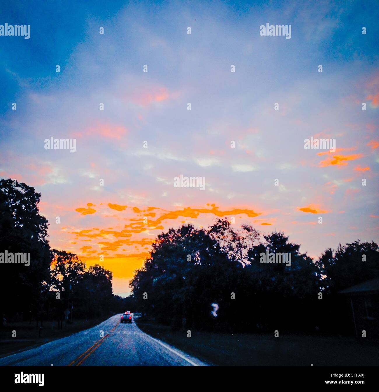 Sunrise glow over highway - Smartphone Captured Stock Image