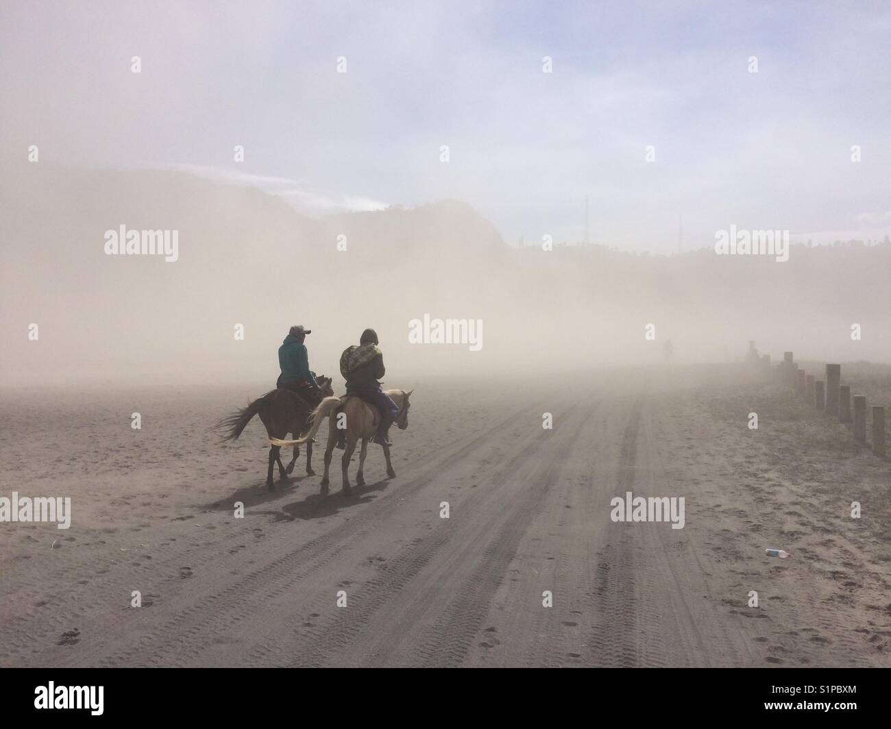 Horsemen, Mount Bromo, Indonesia. Stock Photo