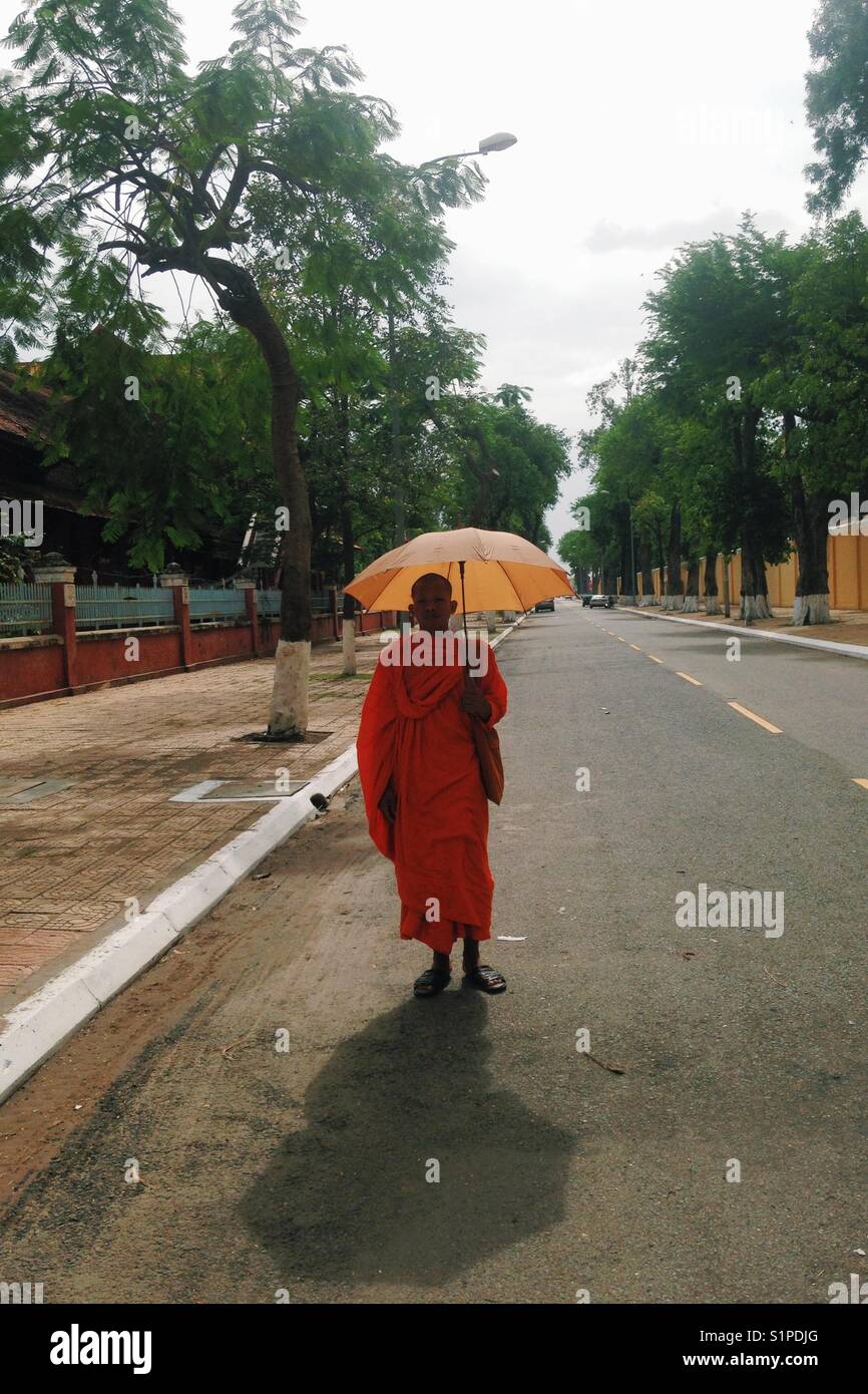monk on the empty street of Cambodia Stock Photo
