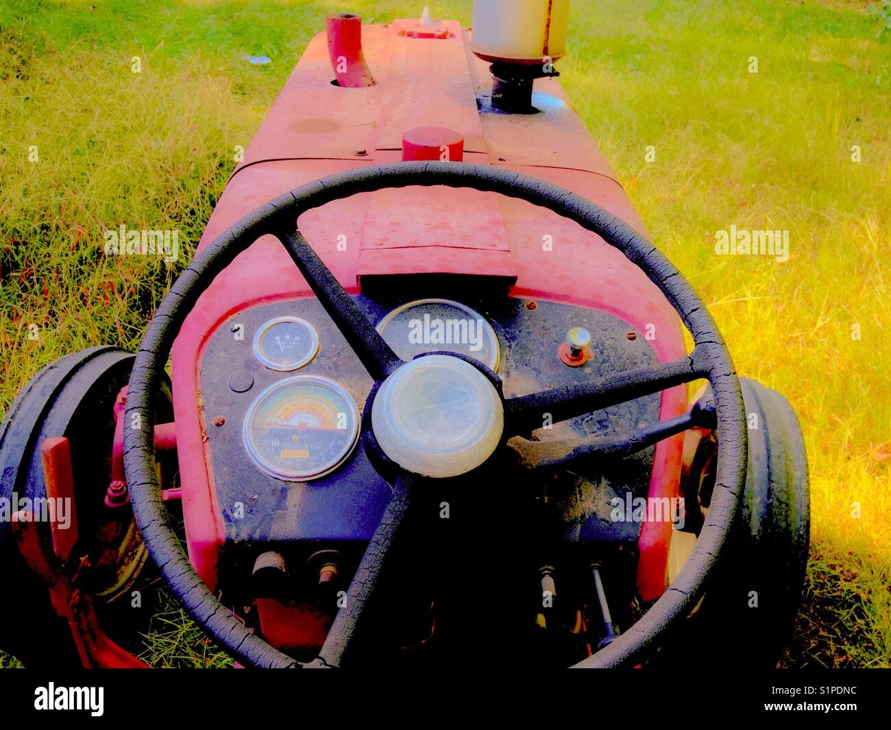 Red tractor steering  wheel - Smartphone Captured Stock Image