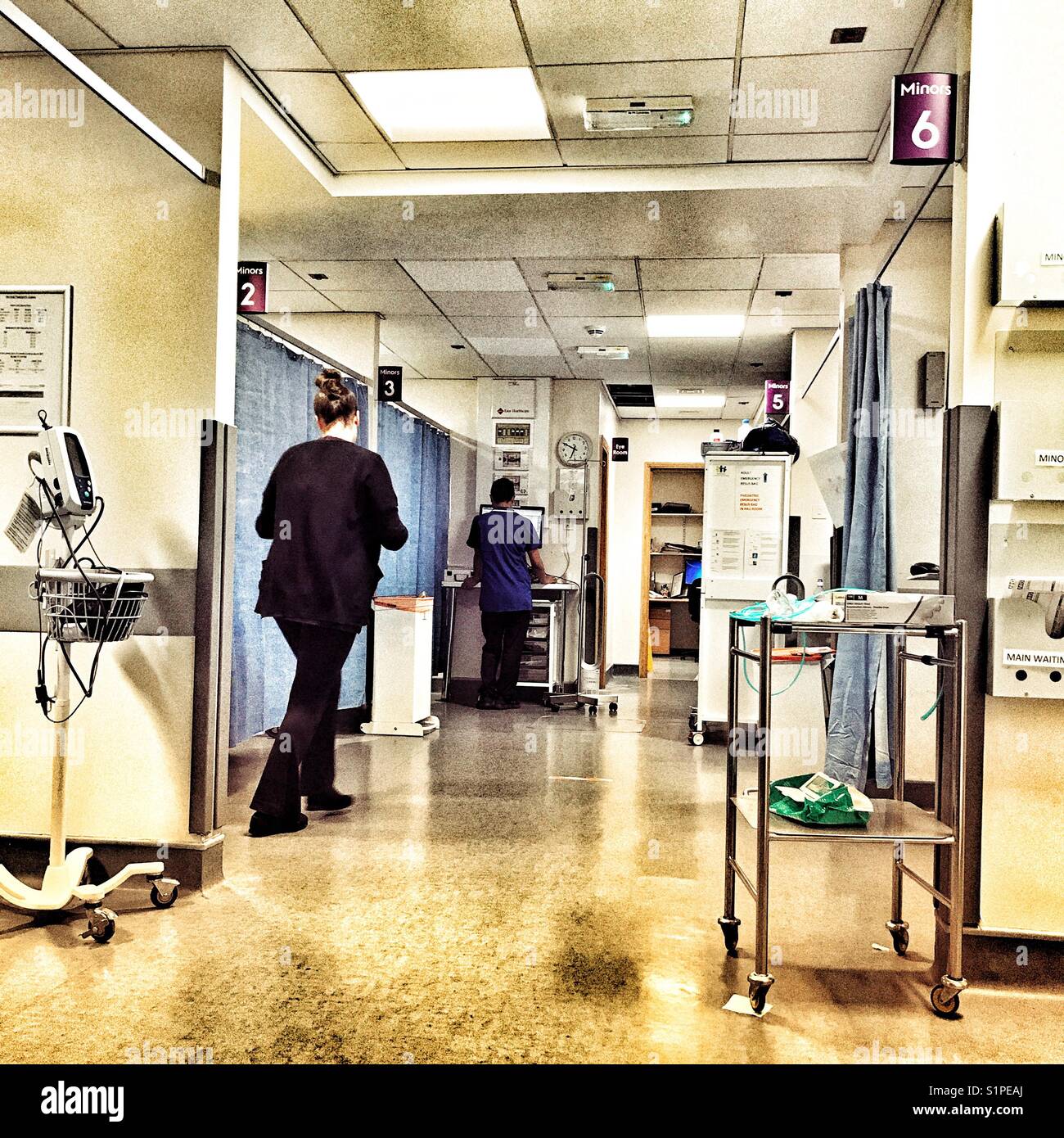 General view of the corridor of treatment rooms in the A&E area of Yeovil Hospital, Somerset, England - Smartphone Captured Stock Image
