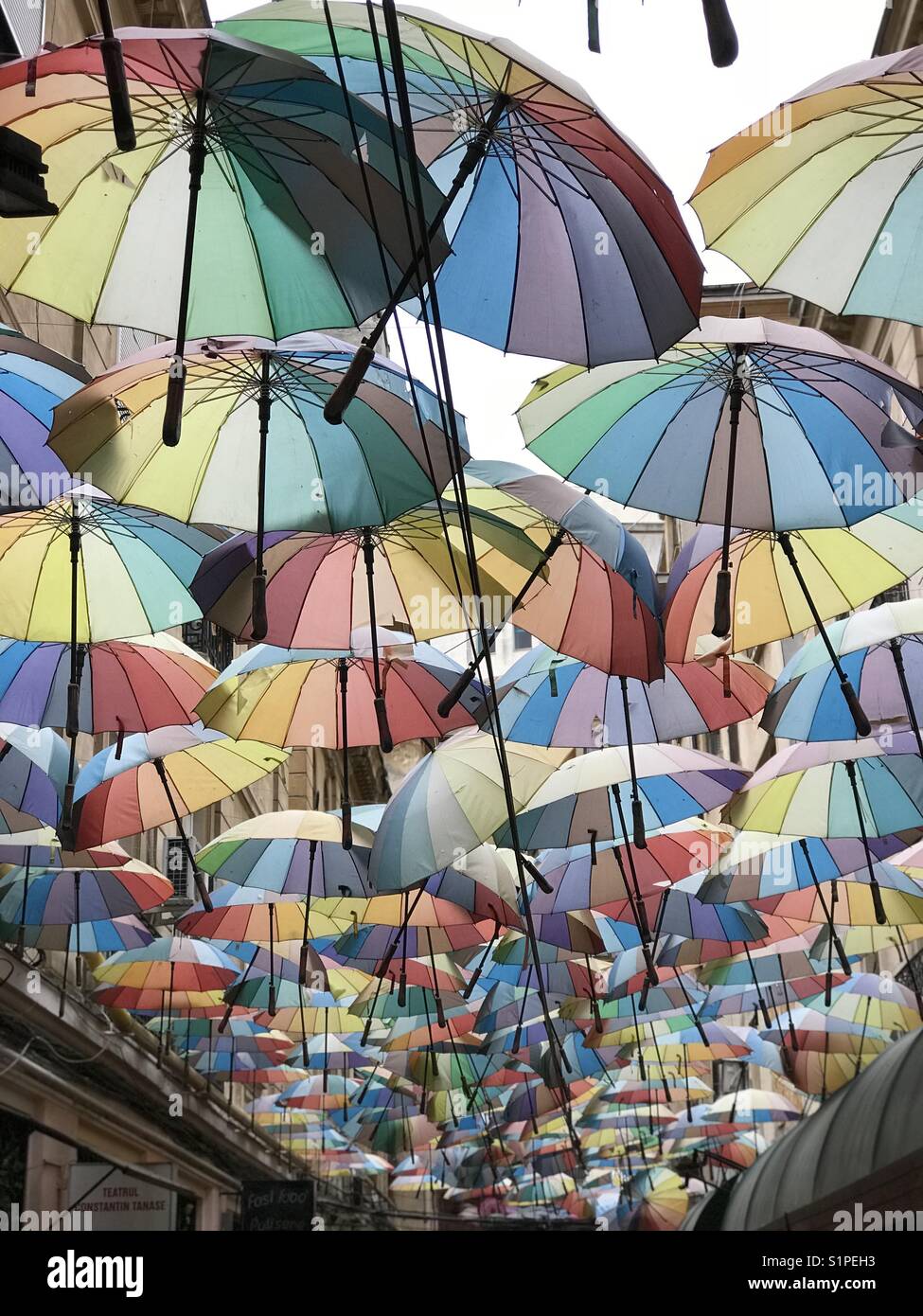 Many multicolored umbrellas, Victoria passage, Bucharest, Romania - Smartphone Captured Stock Image