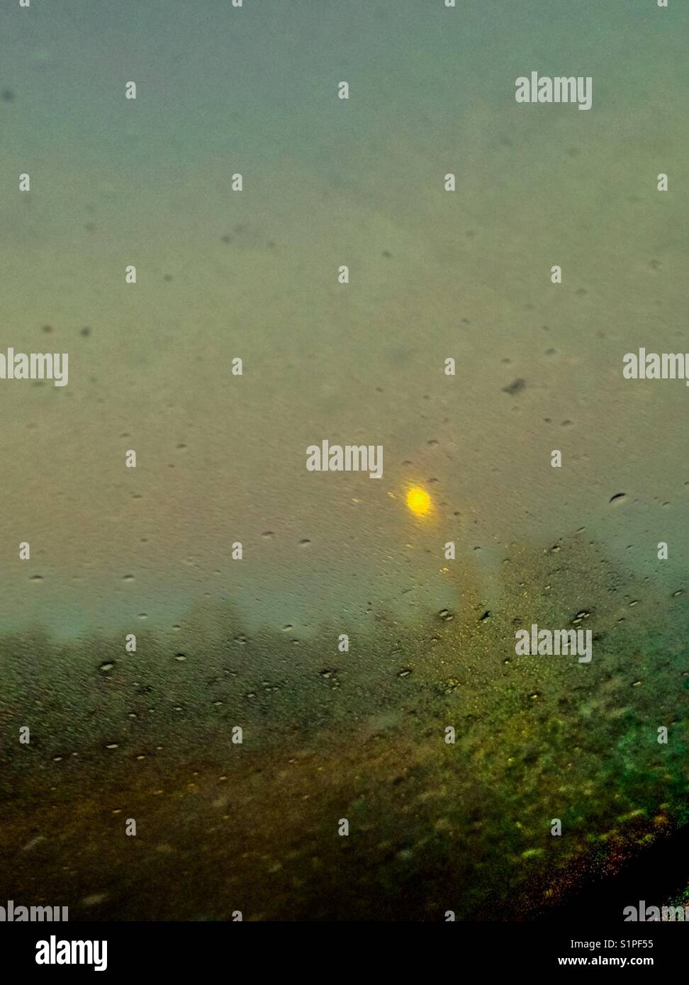 Harvest moon morning through dirty windshield - Smartphone Captured Stock Image